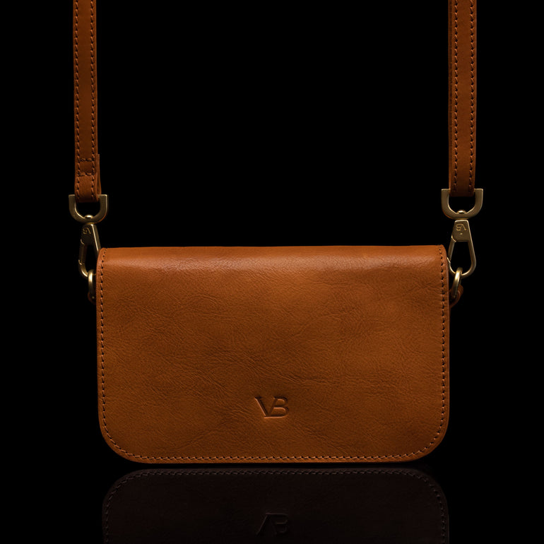 Von Baer Isabella luxury small leather shoulder bag with adjustable strap in tan, front view.