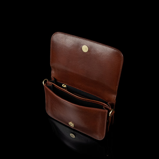 Von Baer Isabella small full-grain leather shoulder bag in brown, featuring two compartments and a zipped pocket inside.
