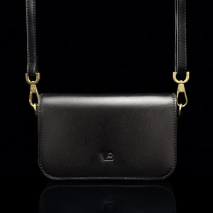 Von Baer Isabella small leather shoulder bag with adjustable strap in black, front view.