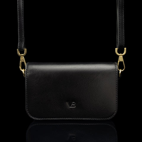 Von Baer Isabella small leather shoulder bag with adjustable strap in black, front view.