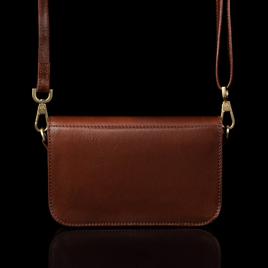 Von Baer Isabella small leather shoulder bag with adjustable strap in brown, back view.