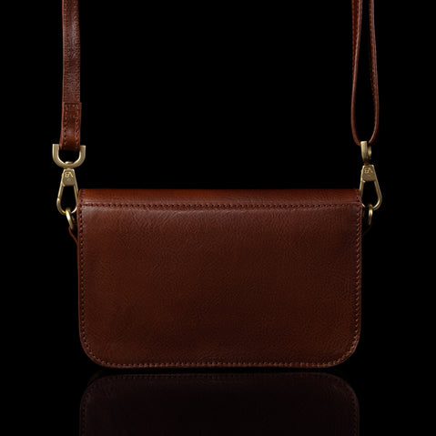 Von Baer Isabella small leather shoulder bag with adjustable strap in brown, back view.