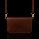 Von Baer Isabella small leather shoulder bag with adjustable strap in brown, front view.