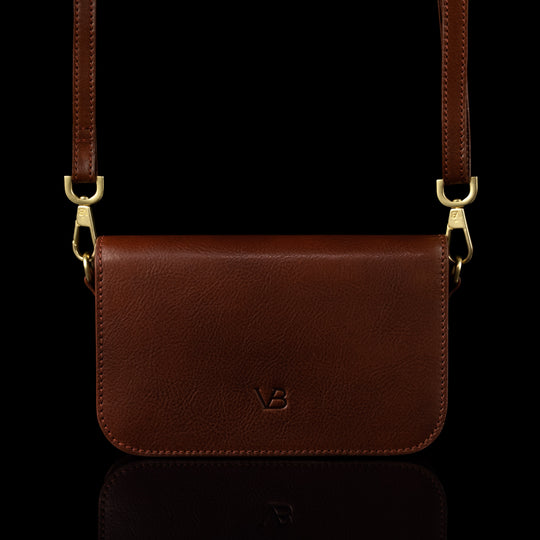 Von Baer Isabella small leather shoulder bag with adjustable strap in brown, front view.
