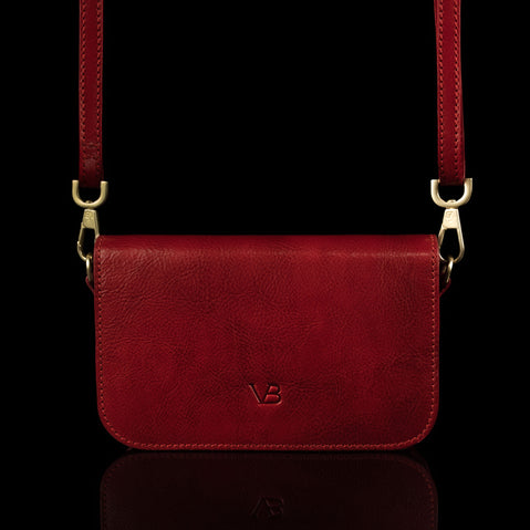 Von Baer Isabella small leather shoulder bag with adjustable strap in red, front view.
