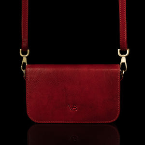 Von Baer Isabella small leather shoulder bag with adjustable strap in red, front view.