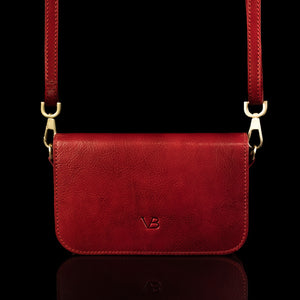 Von Baer Isabella small leather shoulder bag with adjustable strap in red, front view.