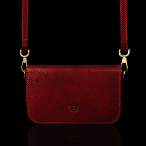 Von Baer Isabella small leather shoulder bag with adjustable strap in red, front view.