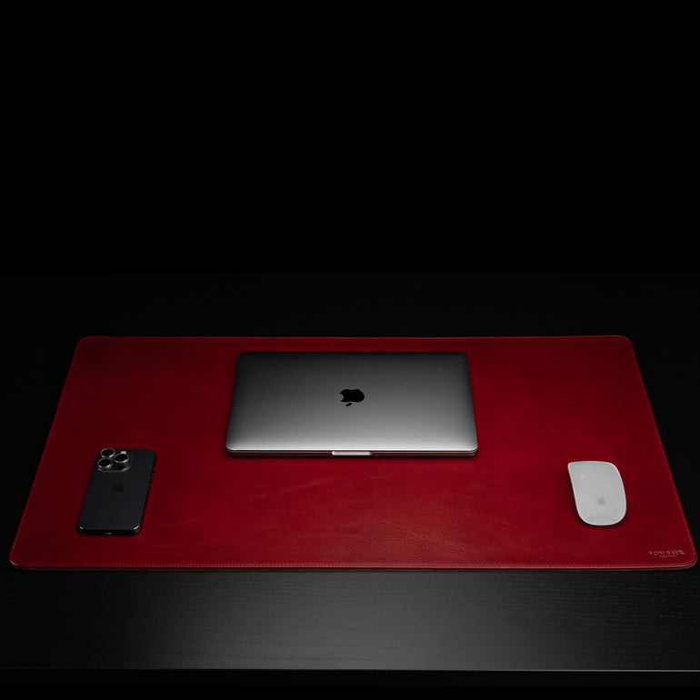 Von Baer large high-quality luxury full-grain leather desk mat in red, front view with MacBook, phone, and mouse