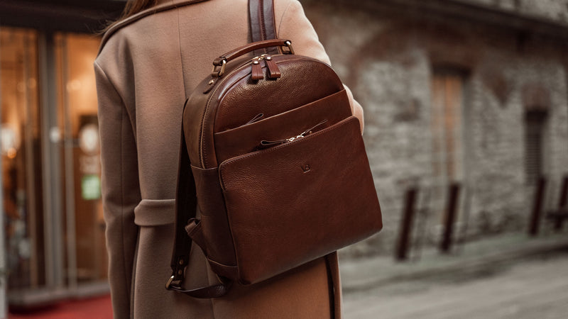 Von Baer Liberty stylish women's full-grain leather backpack brown on a woman in a beige coat