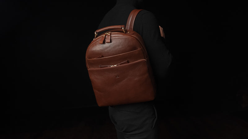 Von Baer Liberty stylish women's full-grain brown leather backpack on male model slider