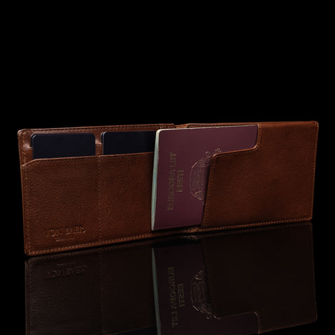 von baer luxurious leather passport holder travel rfid wallet brown with cash cards and passport inside upper view