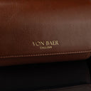 A close-up of the 'Von Baer Tallinn' logo on a brown luxury leather watch roll.
