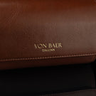 A close-up of the 'Von Baer Tallinn' logo on a brown luxury leather watch roll.