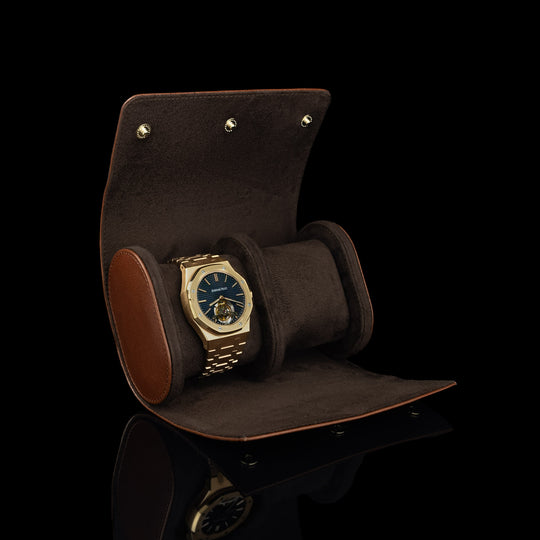 A front view of a brown Von Baer luxury leather watch roll with an Audemars Piguet watch inside.