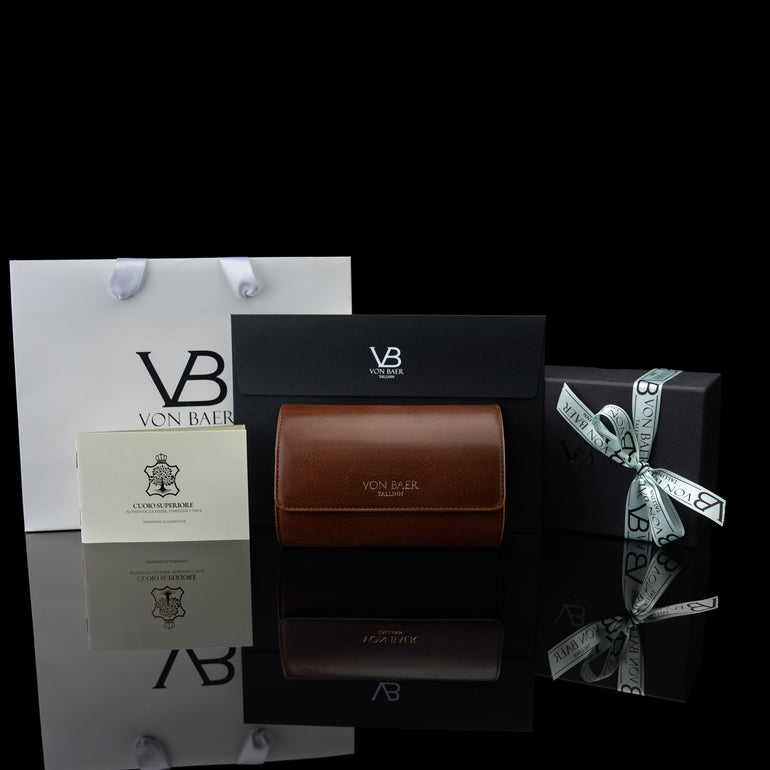 A brown Von Baer luxury leather watch roll in its gift packaging, ready to be gifted.