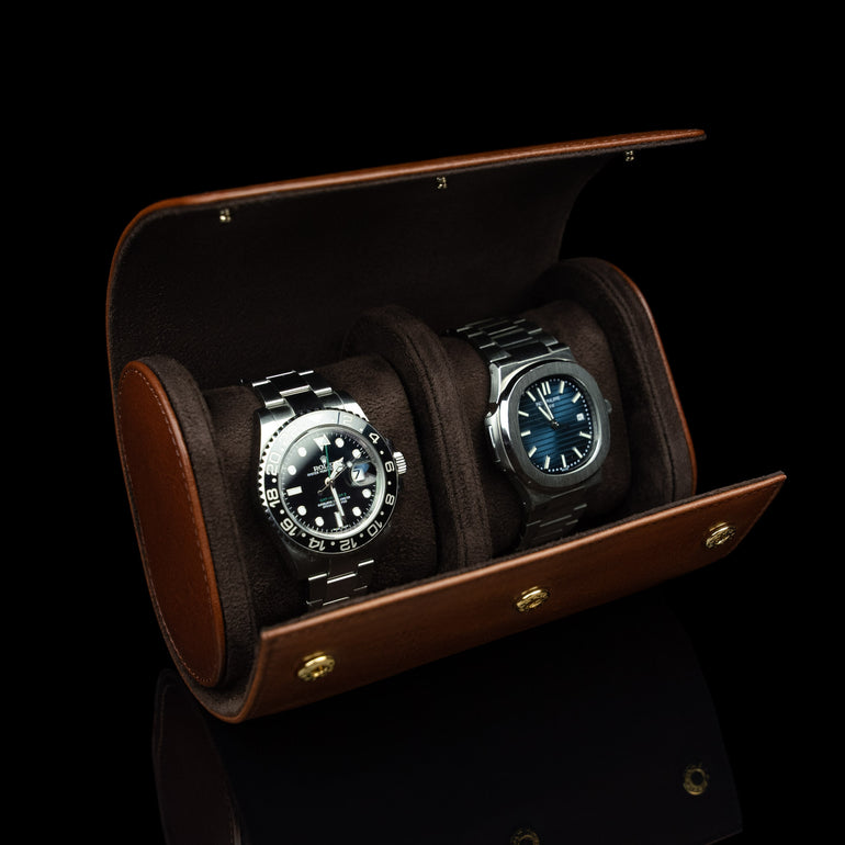 A brown Von Baer luxury leather watch roll with a Rolex watch inside, a perfect gift idea.