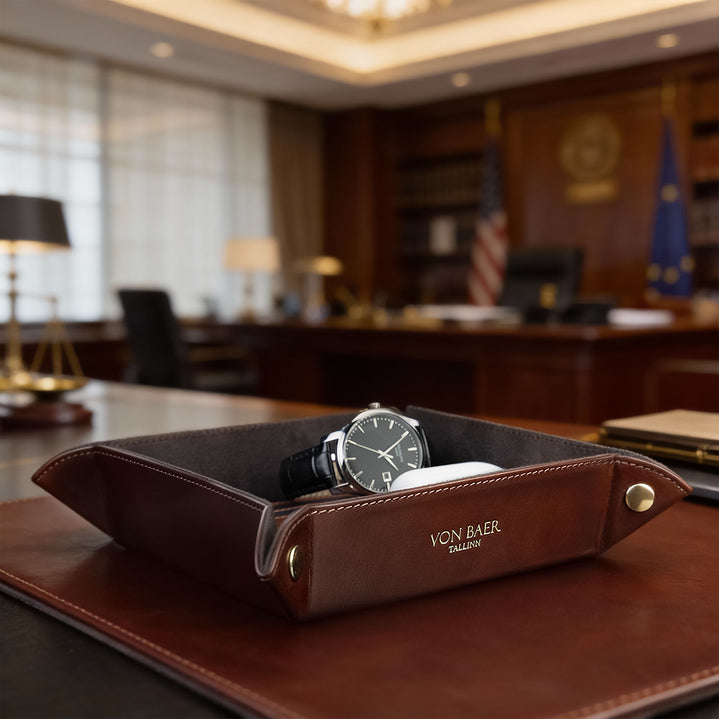 Von Baer Majestic luxury Italian leather tray desk organizer, catch-all in brown, placed on a leather desk pad and filled with office essentials.