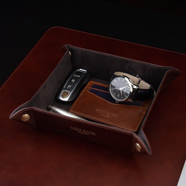 Von Baer Majestic luxury Italian leather tray desk organizer, catch-all in brown, elegantly placed on a leather desk pad and filled with essential items.