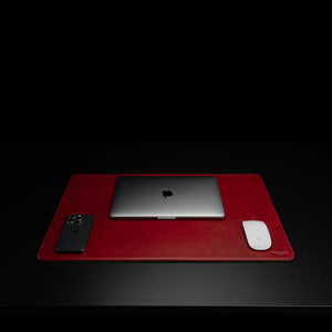 Von Baer medium luxury leather desk mat in high-quality, crafted in red color, featuring a front view with a MacBook, offering both style and durability.