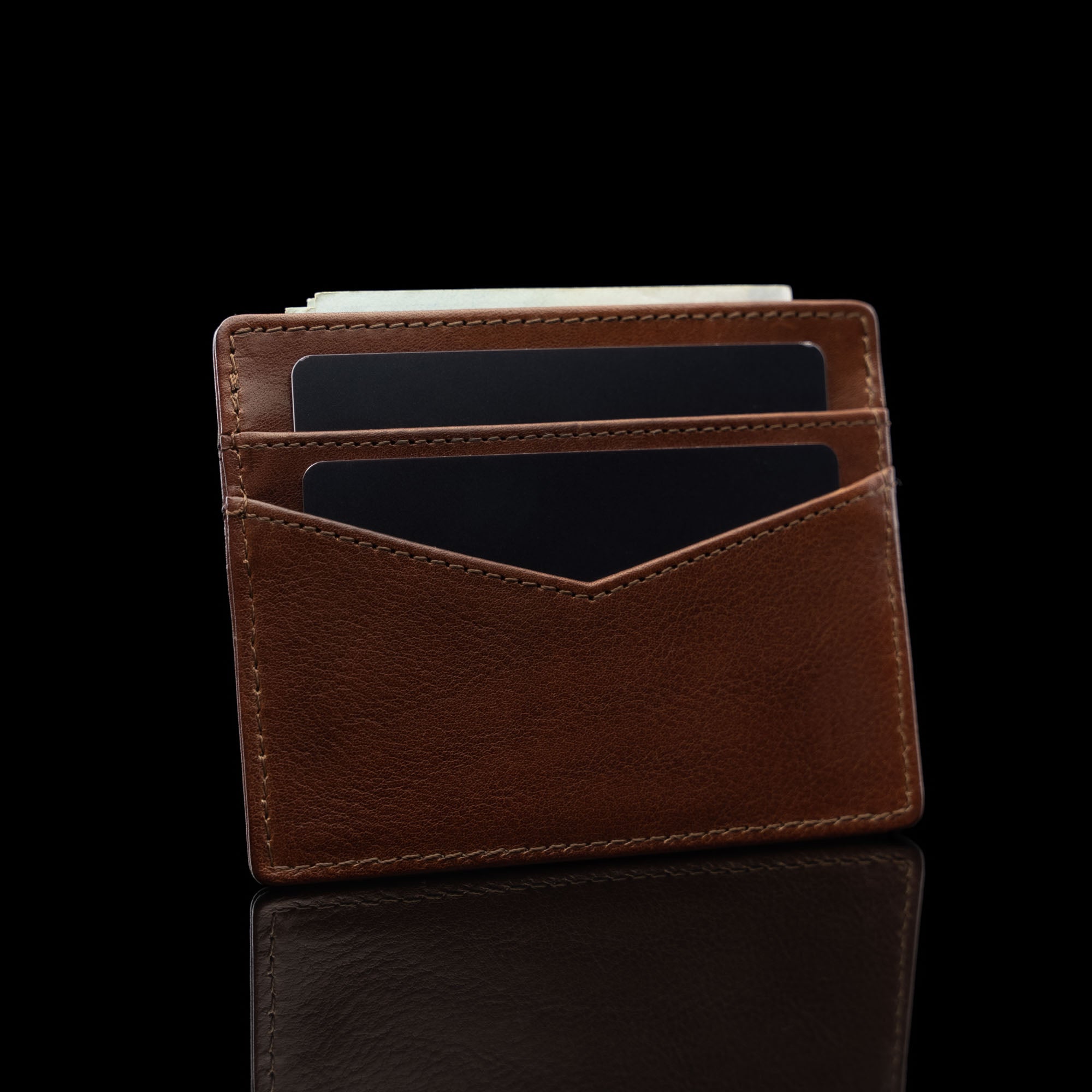 von baer minimalist womens slim leather card holder brown filled with cards and money rear view