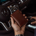 von baer minimalistic and luxury grant leather card case wallet solid brown holding in hands