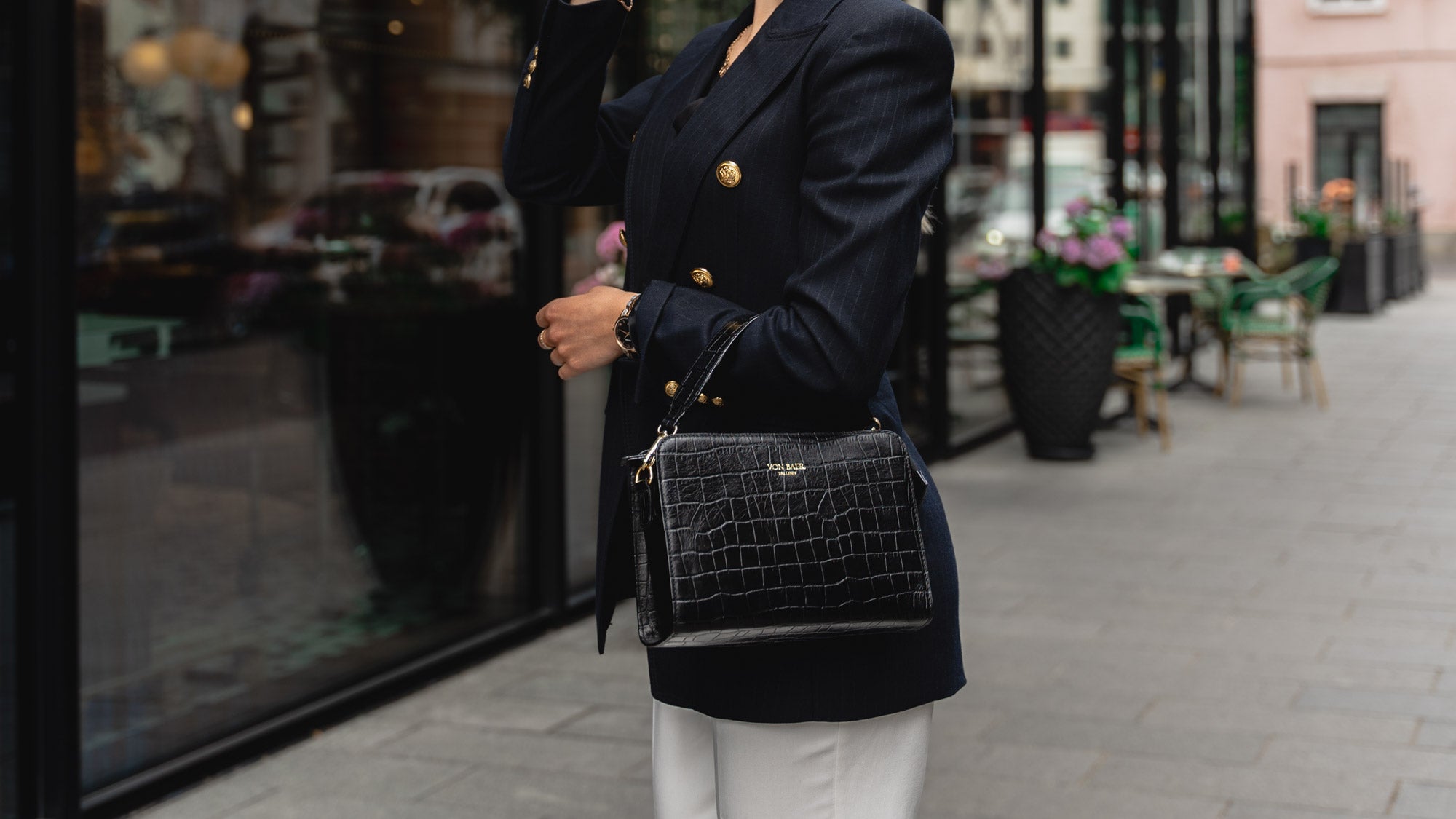 Von Baer Model 1 small luxury leather purse in croco style close-up lifestyle slider