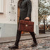 no.1 briefcase held by a man in a suit walking down the street