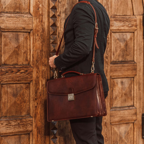 man carrying the no1 briefcase by the shoulder strap