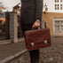 von baer no.2 luxurious italian vegetable tanned leather briefcase held by man in suit