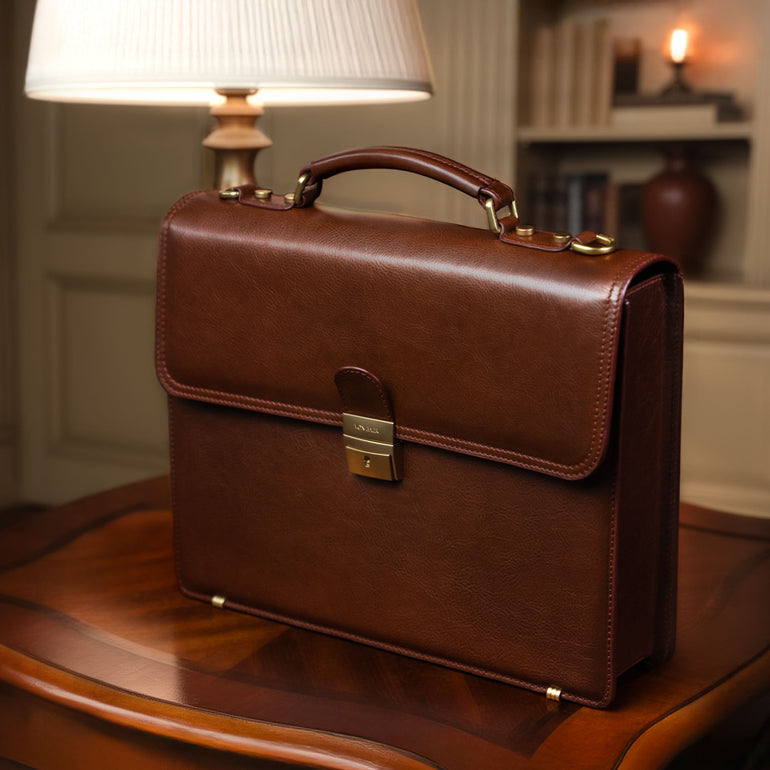 Von Baer No.3 luxurious compact full-grain leather briefcase for men in a classic luxury office with vintage lamp interior.