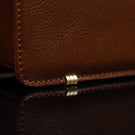 Von Baer No.3 men’s compact full-grain leather briefcase protective metal feet close-up showing durable design for professional use.