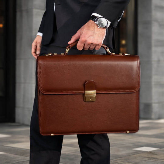 Von Baer No.3 men’s classic compact full-grain leather briefcase in brown, city setting for businessman and professional work.