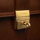 Von Baer No.3 men’s full-grain leather briefcase key lock closure close-up showing secure locking system for professionals and business use.