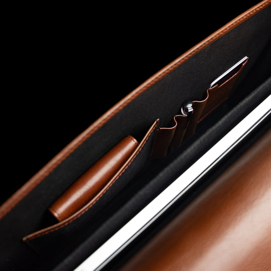Von Baer No.3 slim full-grain leather briefcase interior top view showing organized compartments for laptop, documents, and professional work.