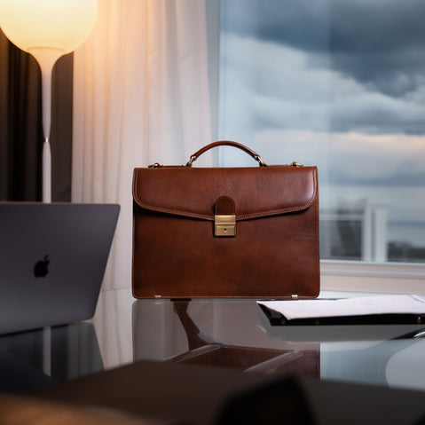 Von Baer No.1 luxury men’s leather briefcase in brown in a CEO office, large professional work bag for documents and laptop.