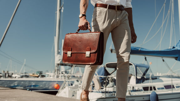 von baer no.2 luxury leather messenger briefcase brown carried by businessman in harbour slider