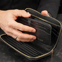 Von Baer origin luxury RFID men’s leather wallet in black held by a male model with detachable card holder, premium wallet for cards and cash.