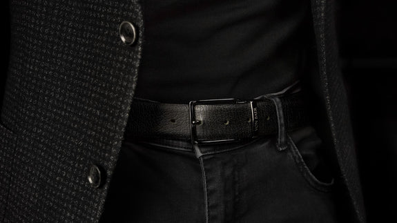 Von Baer Premier luxury reversible handmade premium leather belt for men, showcasing the black side, worn by a male model, with a close-up slider view.