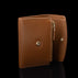 Von Baer Reverie elegant compact cognac pebbled leather wallet for women, shown open from the side against a black background, highlighting the side zipper and gold-tone hardware