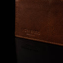 von baer slim luxurious leather passport holder travel rfid portmone brown logo close up