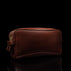 Von Baer superior luxury full grain leather wash bag in brown, shown in a half-turned view, highlighting its refined craftsmanship and spacious design.