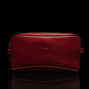 Von Baer superior luxury full-grain leather women's toiletry bag in red, front view.