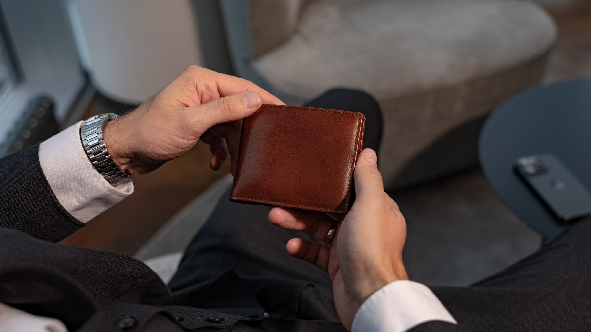 Von Baer Tallinn luxury high-quality Italian leather money clip wallet with RFID protection in the hands of a man at Radisson Collection