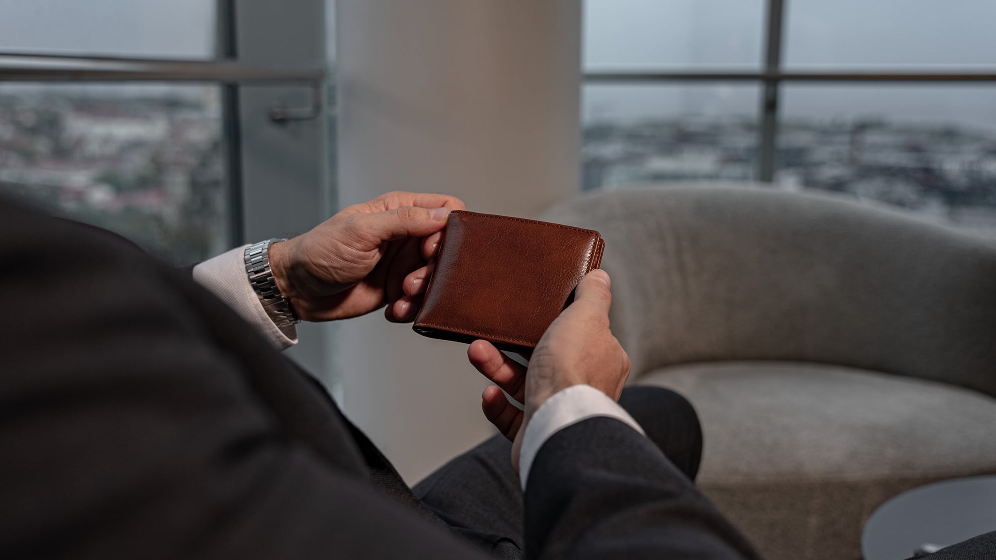 Von Baer Tallinn luxury high-quality Italian leather money clip wallet with RFID protection, held by a man in the Radisson Collection, blending practicality and elegance.