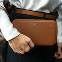 Von Baer W2 luxury large leather purse with wrist strap held by a female model