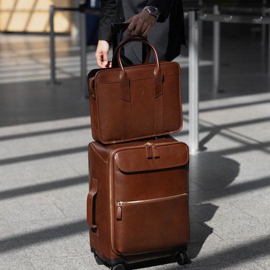 Von Baer Voyager luxury carry-on trolley bag in airport with attached laptop bag