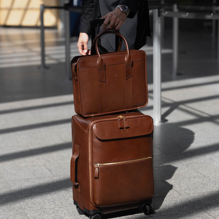 Von Baer Voyager luxury carry-on trolley bag in airport with attached laptop bag