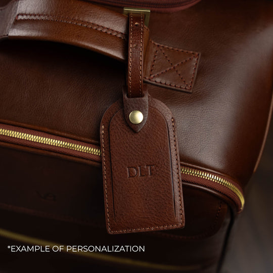 Von Baer Voyager luxury brown leather carry-on trolley bag with personalized embossed initials on luggage tag
