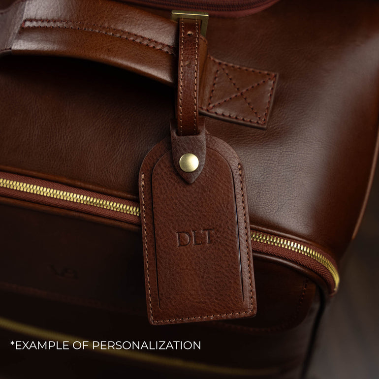Von Baer Voyager luxury brown leather carry-on trolley bag with personalized embossed initials on luggage tag